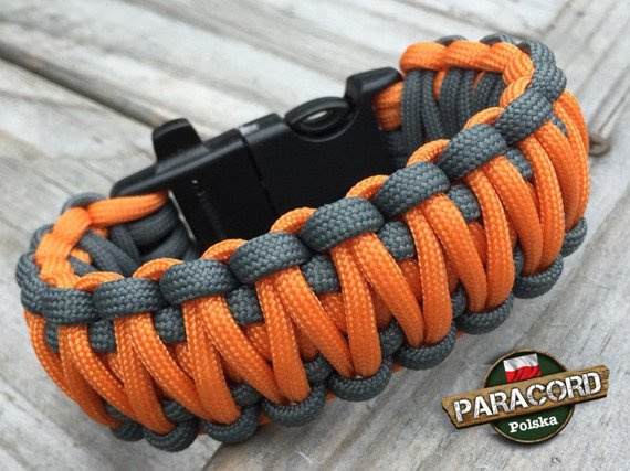 Bransoleta z Paracordu typ "King Cobra" na klamrze z wbudowanym gwizdkiem, krzesiwem i blachą, Kolor "Orange Yellow - Gun Metal"