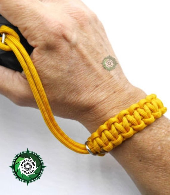 Pasek z oryginalnego Paracordu typ III 550 o siedmiu rdzeniach do aparatu, kamery, lornetki, dalomierza, typ splotu "Cobra", kolor "Golden rod"