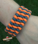 Bransoleta survivalowa z Paracordu typ "Extreme", z wplecioną metalową regulowaną szeklą, kolor: "Orange yellow - Gun metal"